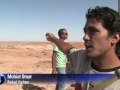 Libya rebels push to cut off defiant Kadhafi