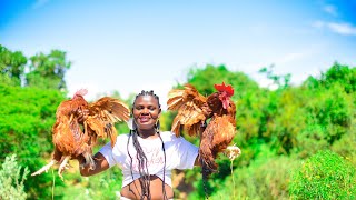 African Village Girl Preparing Two Chicken For Food