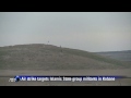 Air strike targets IS militants on a hill in Kobane