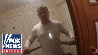 Man armed with kitchen knives attacks police officers Man armed with kitchen knives attacks police officers
