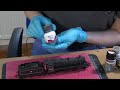 ere Ivana is weathering a steam locomotive using various pro...