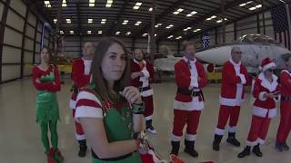 Santas flying over cocoa beach pier: Air Sports Parachute team
