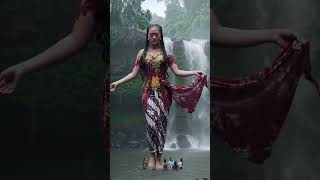 Beautiful Girl From Indonesia Flying Above Waterfall