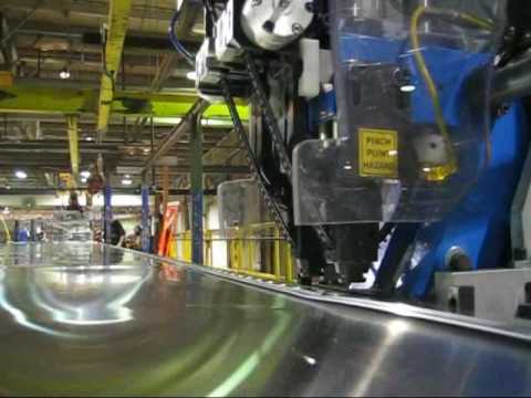 A twin head Henrob Self-Pierce Riveting system automatically walks itself A twin head Henrob Self-Pierce Riveting system automatically walks itself
