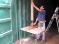 Banging out the dents on a shipping container homes