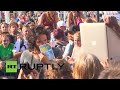 UK: Russell Brand calls for "revolution" during anti-austerity protest