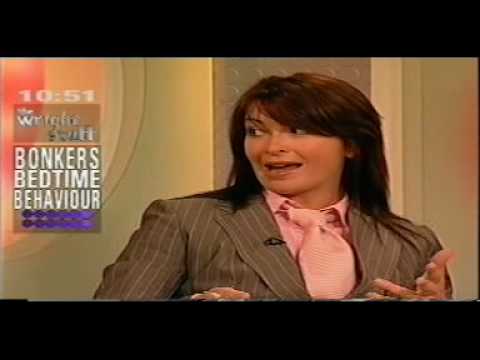 sexy suzi perry looking stunning wearing a nice suit outfit with a pink 