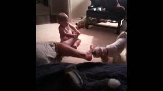 Toddler And Dog Licking Dads Feet