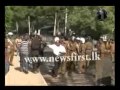 Police use tear gas to disperse the demonstrators in Badulla