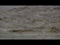 Rushing monsoon flood waters of Uttarakhand