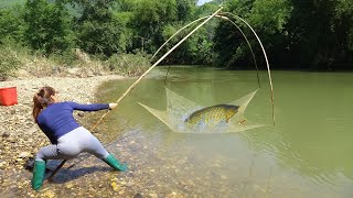 Young Woman Fishing In Rivers, Traditional Fishing With Bamboo And Fishing Nets, Catch A Lot Of Fish