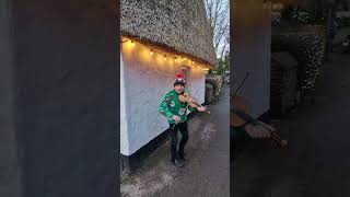 Busker Plays Christmas Song In Bunratty