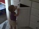 Kathryn plays with the cabinets