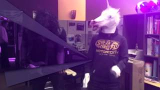 Unicorn mask and Jimmy Hendrix wig at Entercom Sacramento's office party.