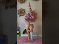 Mother breastfeeding child doing yoga tutorial guide
