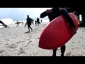 Jim Allen Avila beach California Surfers head to the water.