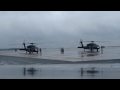 Two UH-60A Blackhawks run-up and taxi for takeoff. [HD - 720p]