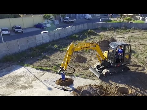 Earth Drill 7000MAX drilling through concrete foundations