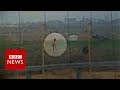 Israeli soldier shoots Palestinian - BBC News