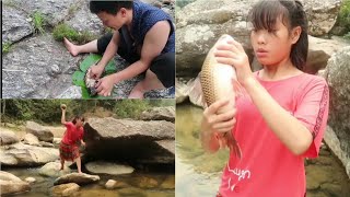 Primitive Stone Fishing By Native Tribal Girl Catch And Cook Fish Beside The River Stream