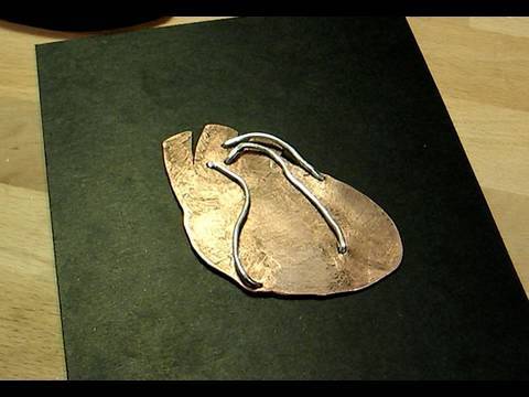 Learn the basics of piercing and texturing metal with just a few tools. Learn the basics of piercing and texturing metal with just a few tools.