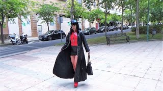Victoria Devil- Long Leather Coat, Leather Miniskirt, Red Vinyl Top, Red Tights And Red Ankle Boots.
