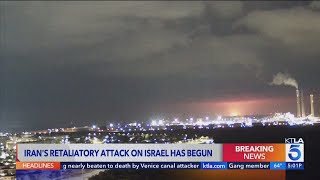 Booms and sirens in Israel after Iran launches over 200 missiles and drones in u