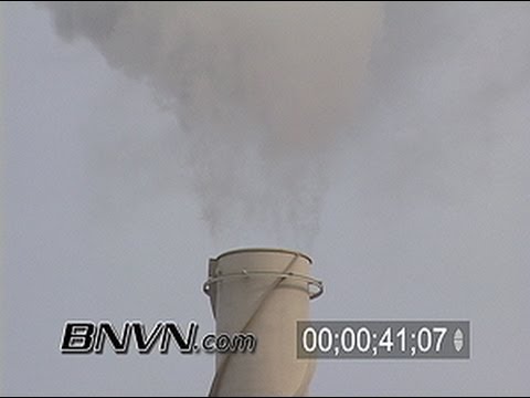 General B-Roll footage of smoke stacks at a power plant and clouds of pollution