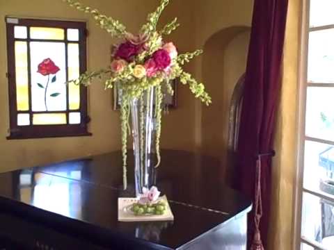  a tall wedding centerpiece with green grapes dendrobium orchids 