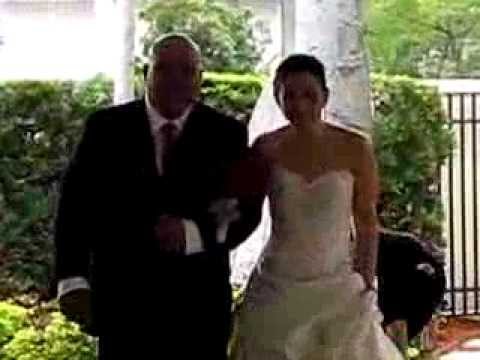 Here Ashley is being escorted by her father to the wedding altar