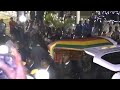 Coffin of ex-president Mugabe arrives at his former residence...