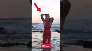 Gal Gadot Shines With Natural Grace In A Serene Seaside Moment.