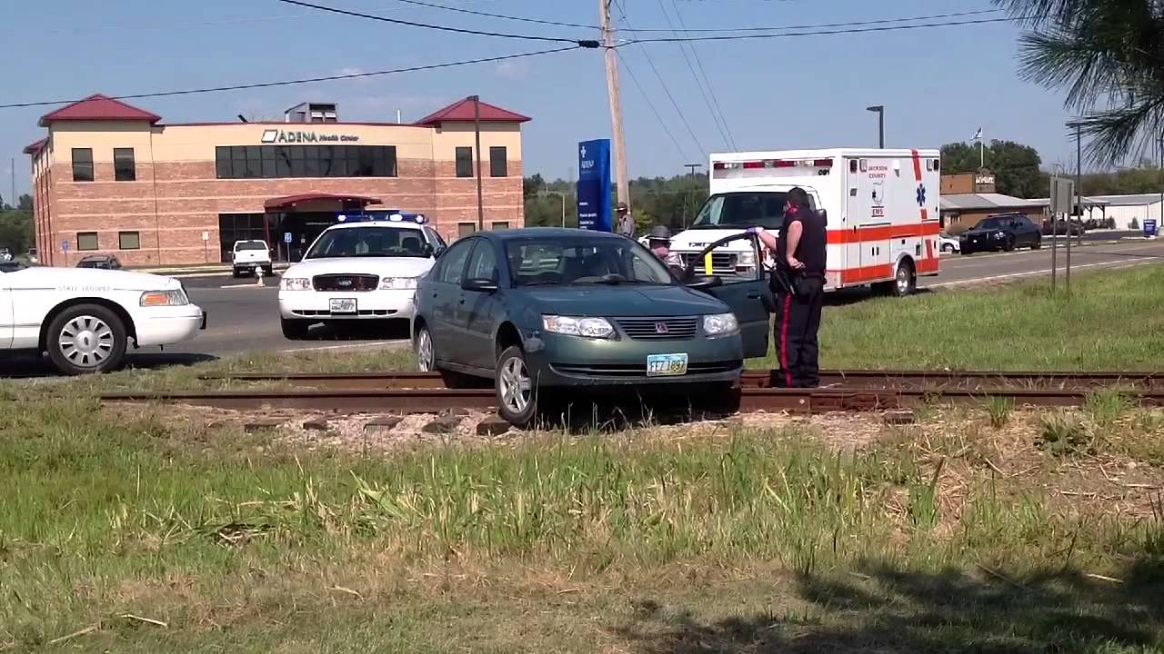 Accident Leaves Car Stuck On Railroad Tracks - YouTube