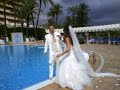 Newly weds jump in the pool in their wedding outfits