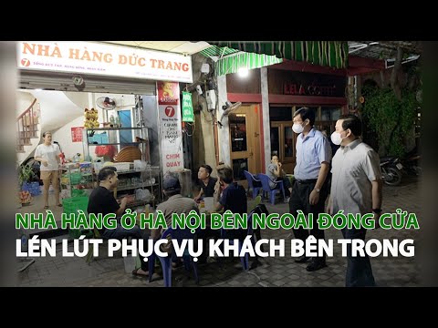 Nhà hàng ở Hà Nội bên ngoài đóng cửa lén lút phục vụ khách bên trong| VTC14