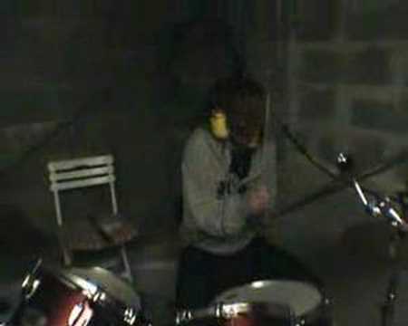 A midget playing drums