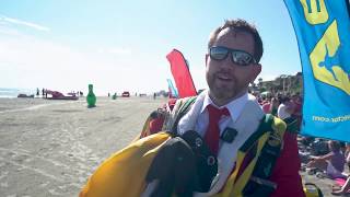 Santas fly in at Cocoa Beach: Air Sports Parachute Team