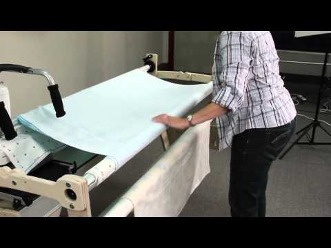 attaching fabric to a wooden Grace Quilting Frame