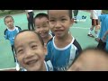 CITY IN CHINA 6: Mike Summerbee plays football on a visit to the SOS Children Village