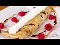 Delicious marshmallow cream stuffed crepes on the griddle top
