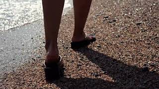 Girl With Cute Feet Out For A Walk On The Beach. Feet Worship
