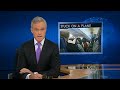 The CBS Evening News with Scott Pelley - Passengers held on plane for seven hours