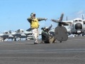 Launching a C-2 Greyhound after a catapult suspend