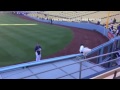Ryu has a pregame toss with a fan in the bleachers