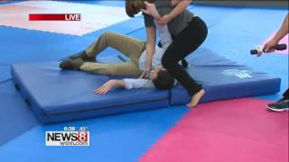 Escape Alive's Daniele Serrano throws News 8's Brian Spyros- 2016