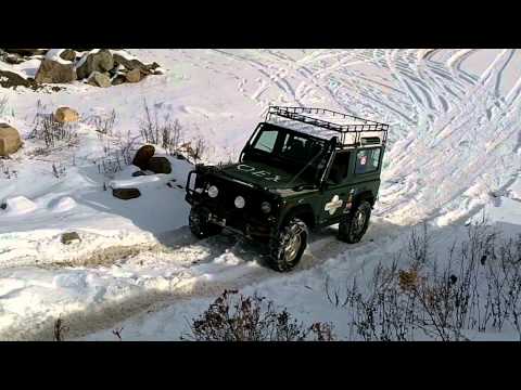 OEX Defender 90 Climing a hill in 1' of snow.