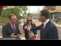 BBC reporter touches woman's breast to move her off camera