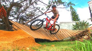 Building a wooden berm in my garden and riding new dirt Jumps!!!