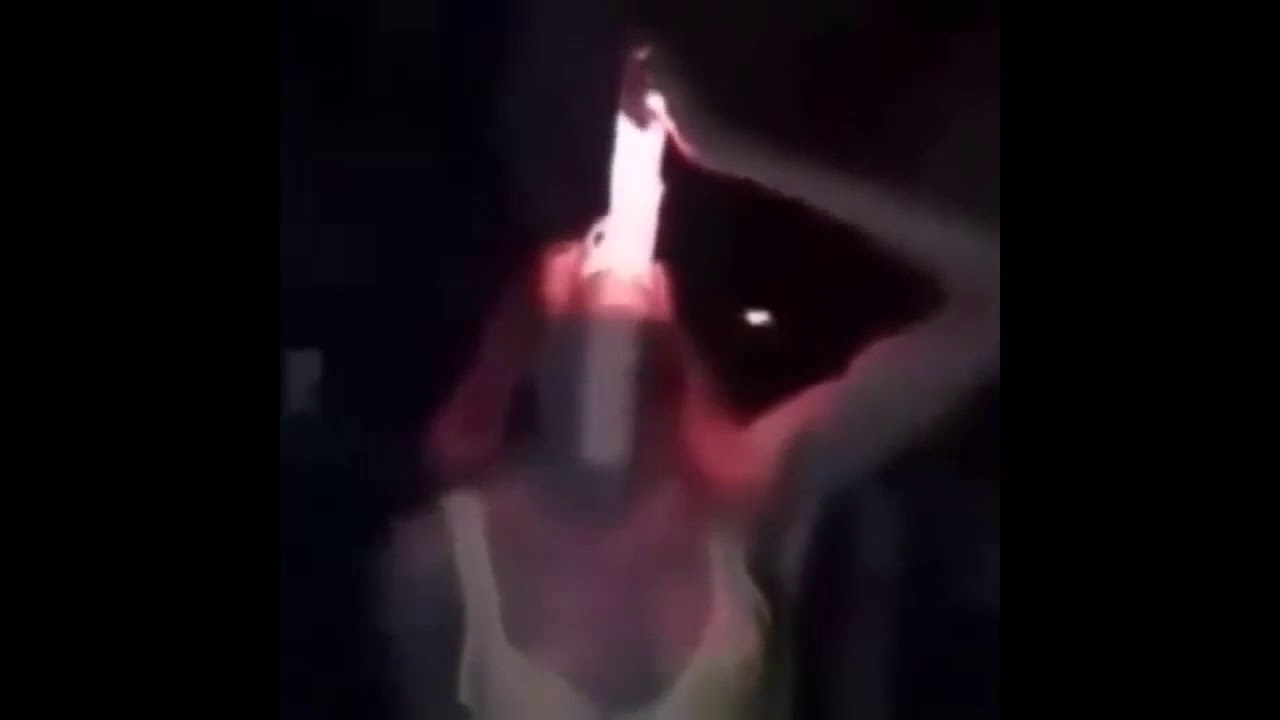 Slut deepthroating glowing dildo image