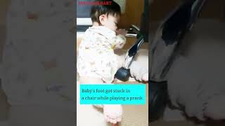 A Baby Whose Feet Get Stuck In A Chair While Playing A Prank And Cant Get Out. Funny Video